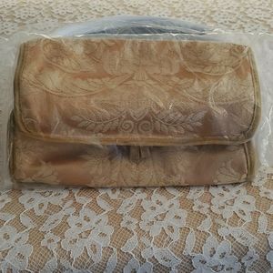 Gold Makeup or Jewelry travel bag. Hanging loop, 4 zipper compartments NWOT